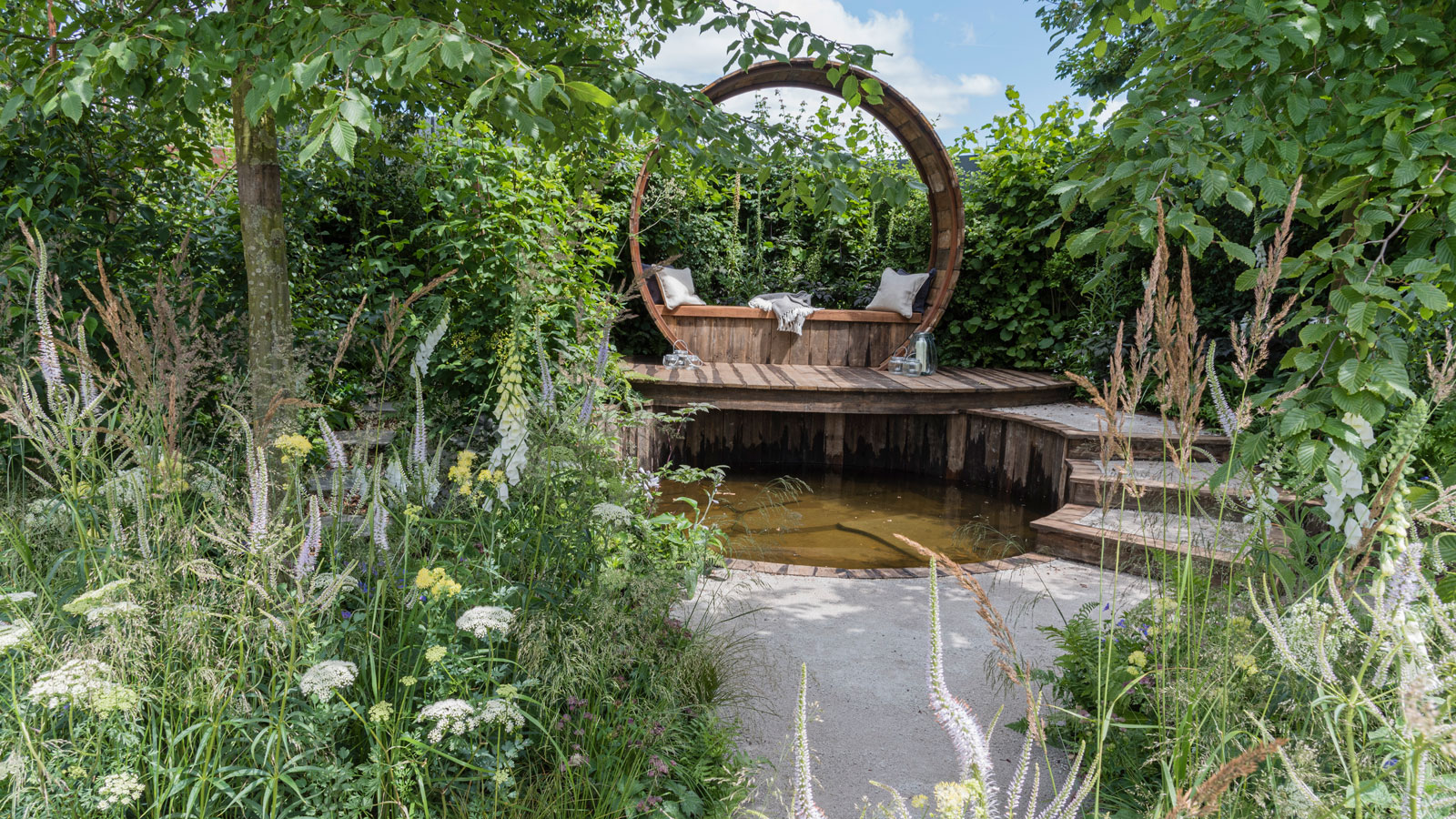 garden retreat design with pond, deck and steps, plus immersive perennial planting and trees