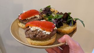 Grilled beef burgers with red pepper on a plate