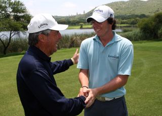 Gary Player and Rory McIlroy shake hands
