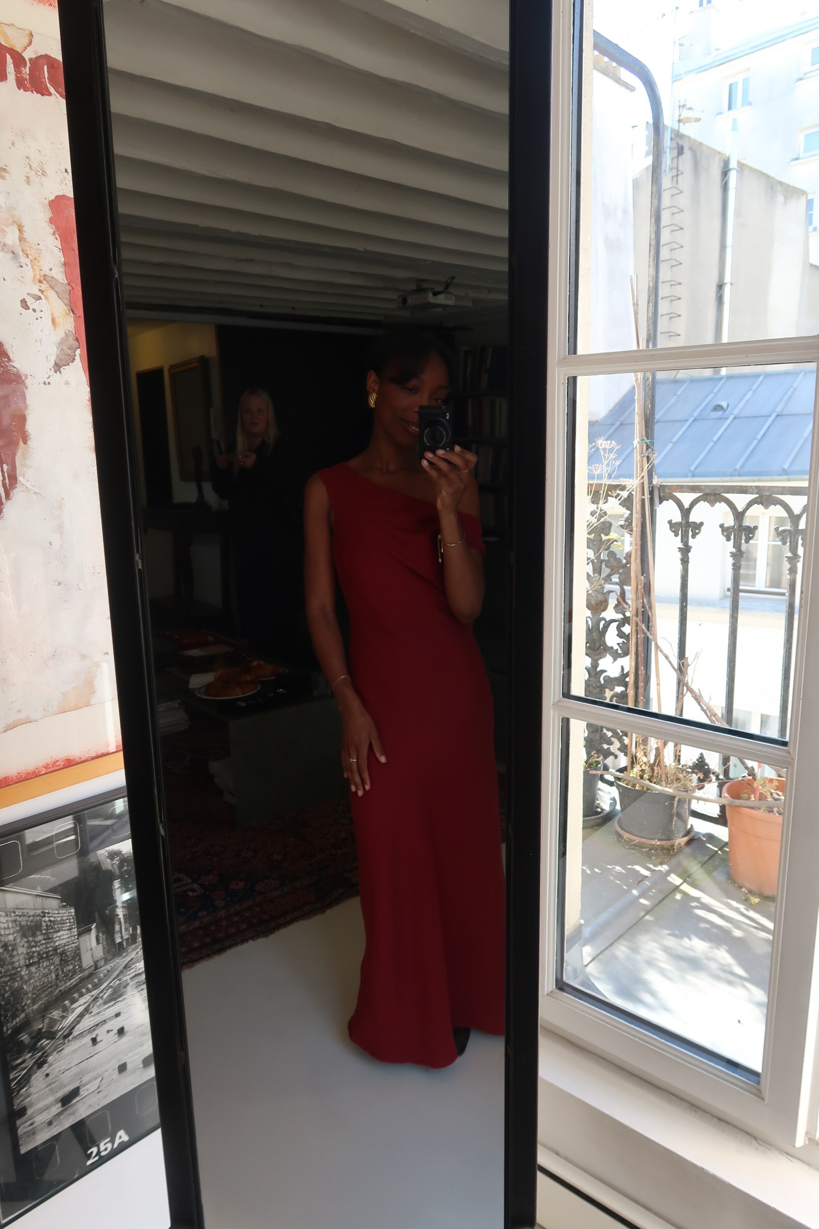 Avalon wears a red linen dress