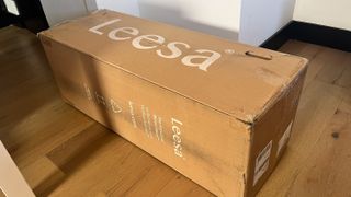 The Leesa Sapira Hybrid Mattress in its delivery box
