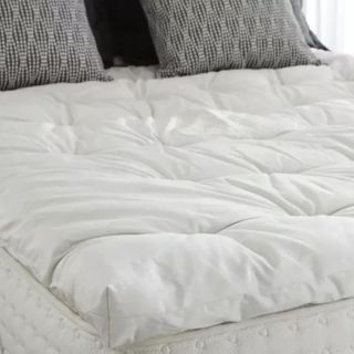 Mattress toppers on bed ontop of brand mattress