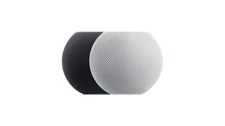 two apple homepod minis, one in black and one in white