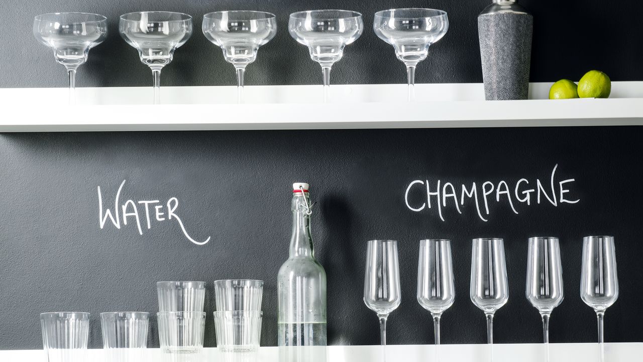 Water and wine glasses on open shelving