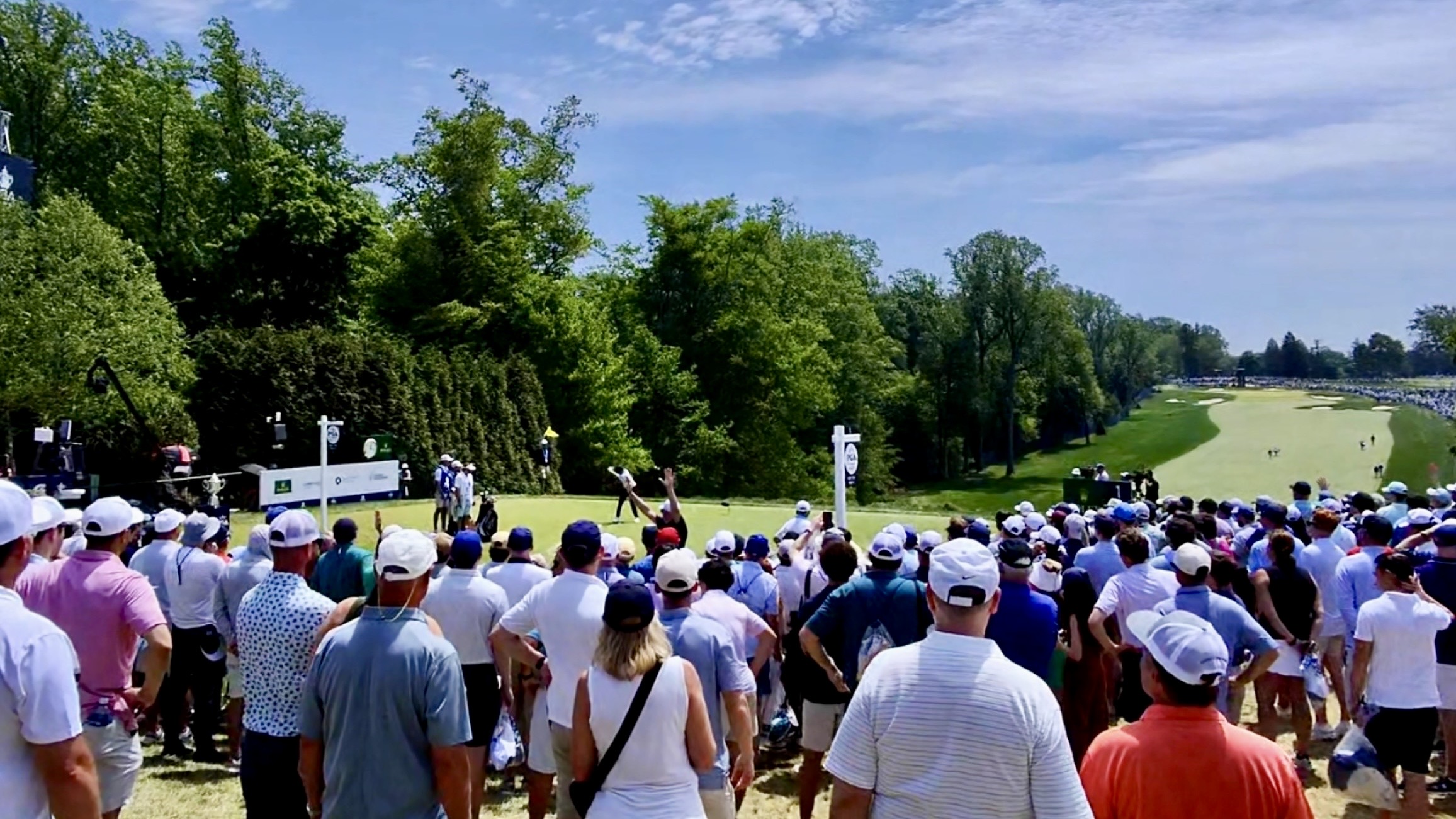 Watching golf at the PGA Championship with a large crowd