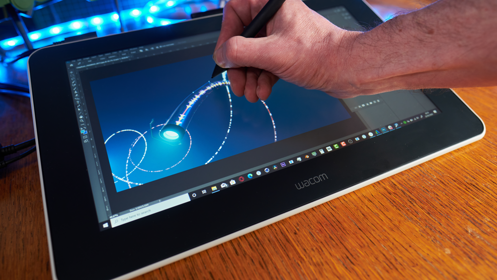 A person drawing on a Wacom One