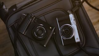 The Fujifilm X-E5 (silver) and GFX100RF (black)