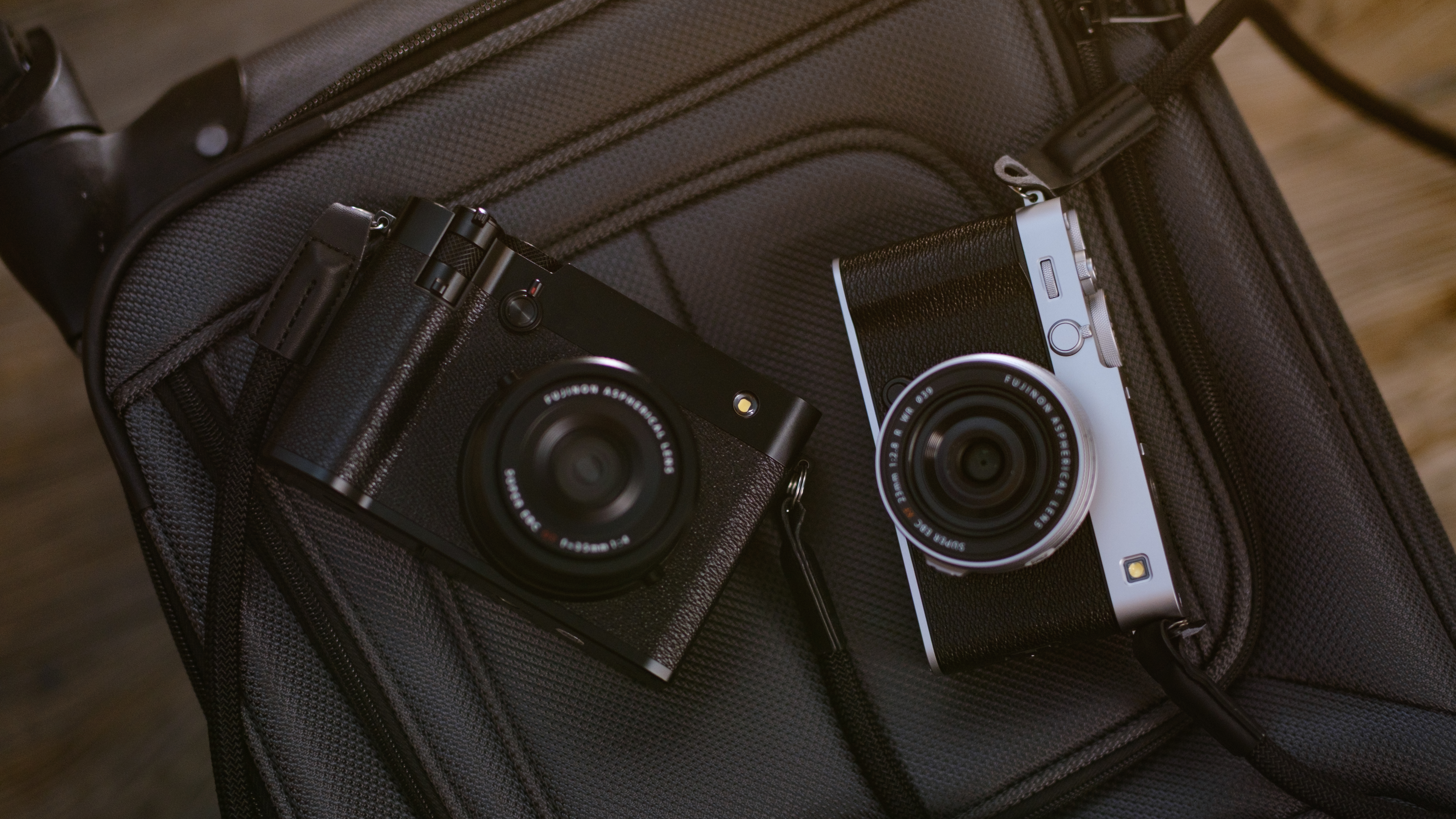The Fujifilm X-E5 (silver) and GFX100RF (black)