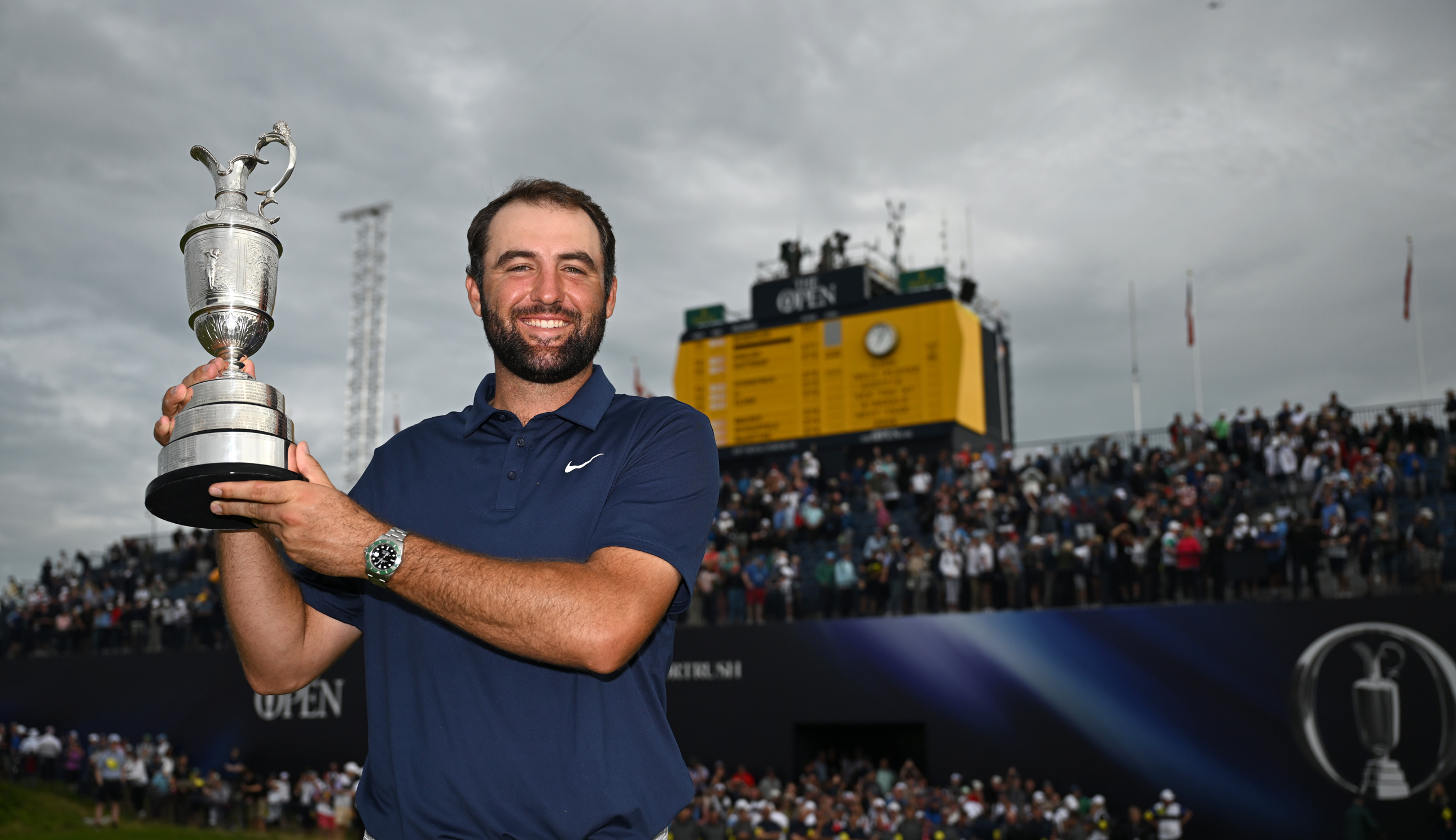 Scottie Scheffler holds the Claret Jug