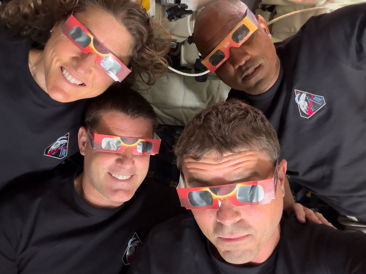 Pictures from Artemis II during the solar eclipse that the astronauts experienced from the dark side of the moon. In this image, Mission Specialist Christina Koch (top left), Mission Specialist Jeremy Hansen (bottom left), Commander Reid Wiseman (bottom right), and Pilot Victor Glover (top right) &ndash; uses eclipse viewers and take a selfie