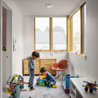 Nest Protect smart smoke alarm and carbon monoxide alarm on the ceiling in a playroom
