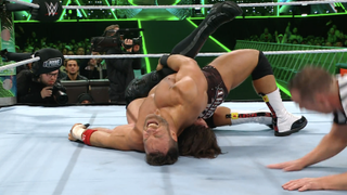 la knight pinning aj styles during a wwe match