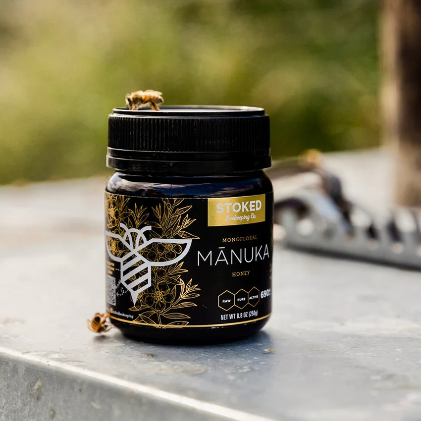 A container of Stoked Beekeeping Co.'s pure mānuka honey