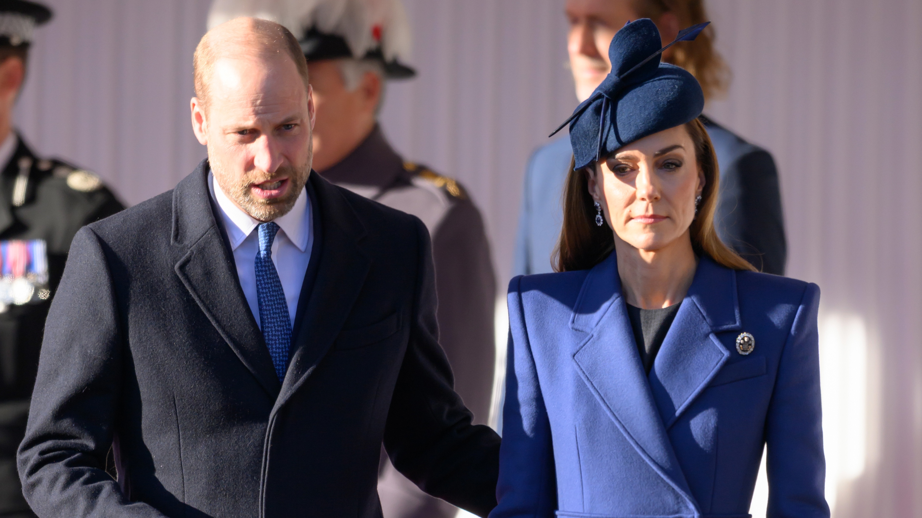 Prince William, Prince of Wales and Catherine, Princess of Wales look serious during the ceremonial welcome for the state visit to the UK of the President of the Federal Republic of Germany