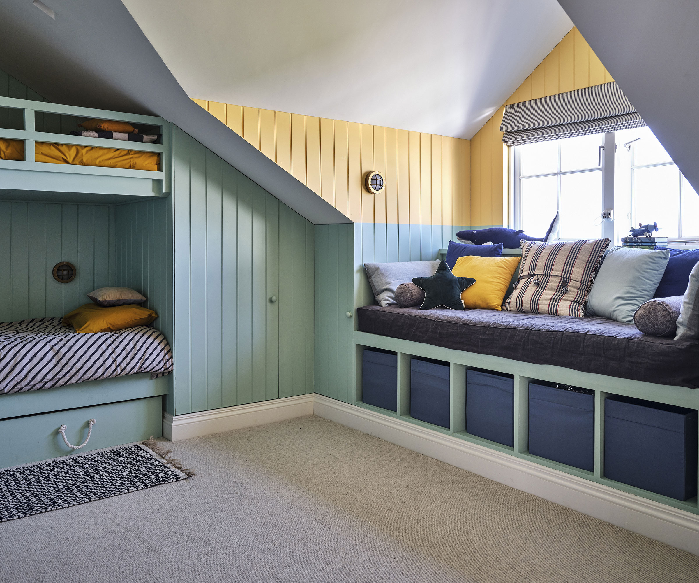 children's bedroom with window seat and bunk beds