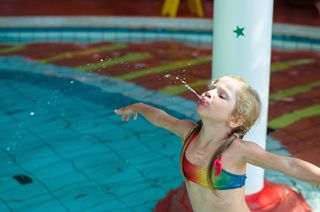 Girl spitting in pool