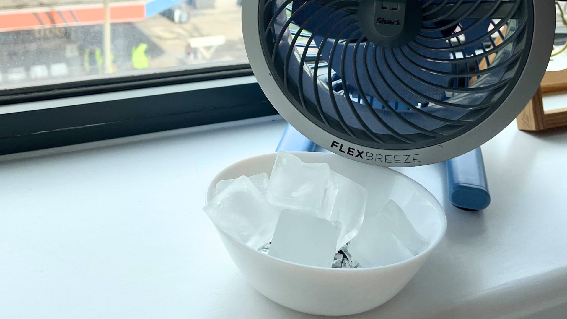 picture of bowl of ice in front of electric fan