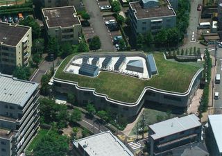 Aerial view showing grass roof of a contemporary building.