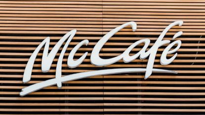 Signage of McCafe, a coffee-house-style food and drink chain, owned by McDonald's, is seen in Hong Kong, Hong Kong, on August 02, 2018. McDonald's reported its second quarter 2018 results, sales at company-owned restaurants plunged by 27 percent during the second quarter and sales at U.S. locations that have been open at least a year grew by 2.6 percent.