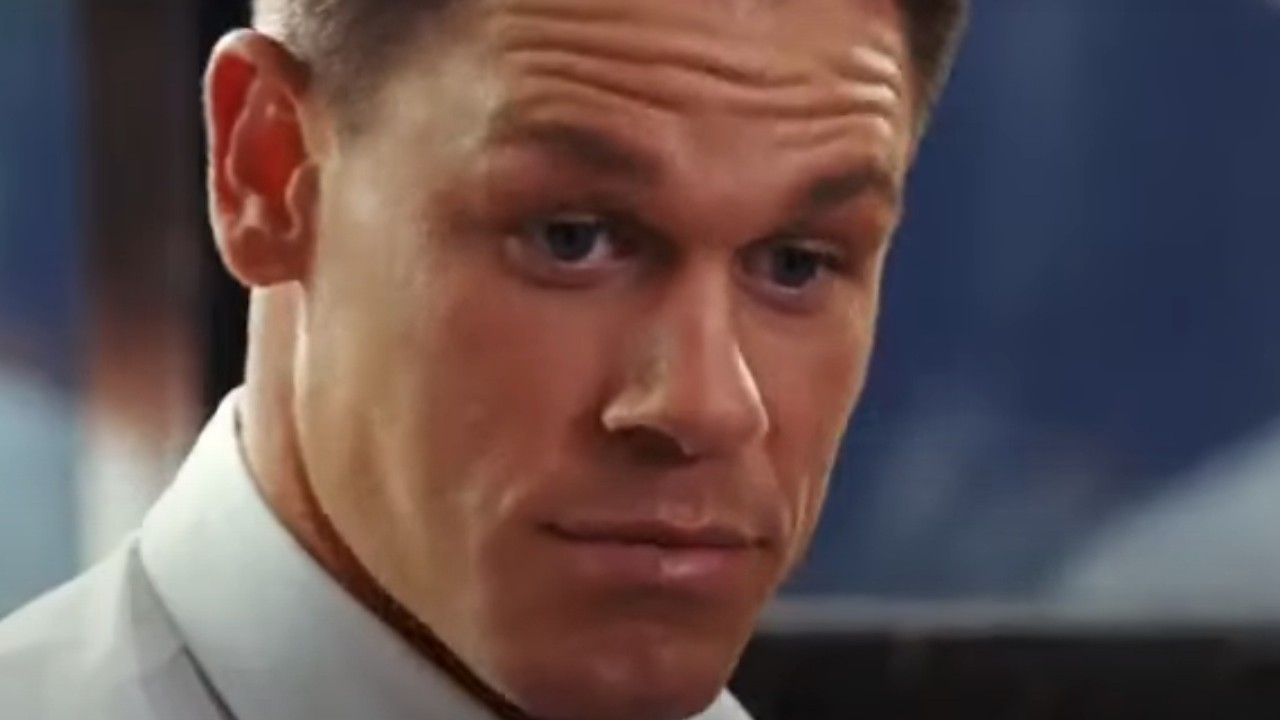 John Cena wearing a white shirt in The Marine