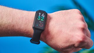the amazfit band 7 fitness tracker, a budget fitness tracker with a simple black band and small yet bright LED screen