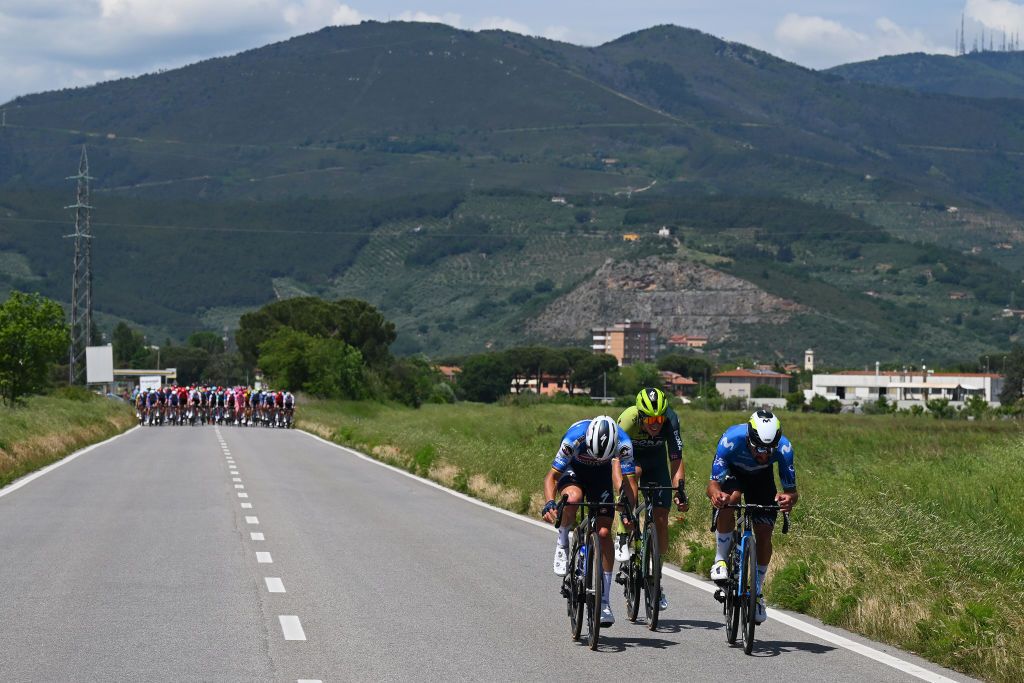 RAPOLANO TERME ITALY MAY 09 A general view of Fernando Gaviria of Colombia and Movistar Team Julian Alaphilippe of France and Team Soudal QuickStep and Danny van Poppel of Netherlands and Team BORA hansgrohe compete passing through a San Giuliano Terme village during the 107th Giro dItalia 2024 Stage 6 a 180km stage from Viareggio to Rapolano terme 322m UCIWT on May 09 2024 in Rapolano terme Italy Photo by Tim de WaeleGetty Images