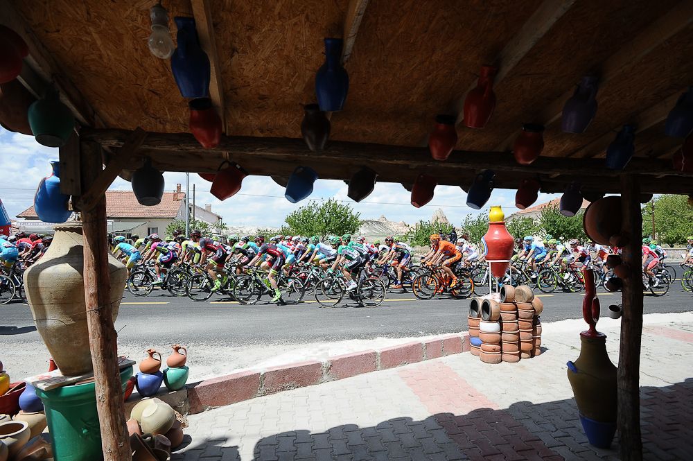The peloton passes a local market during Stage 2 of the 2016 Tour of Turkey