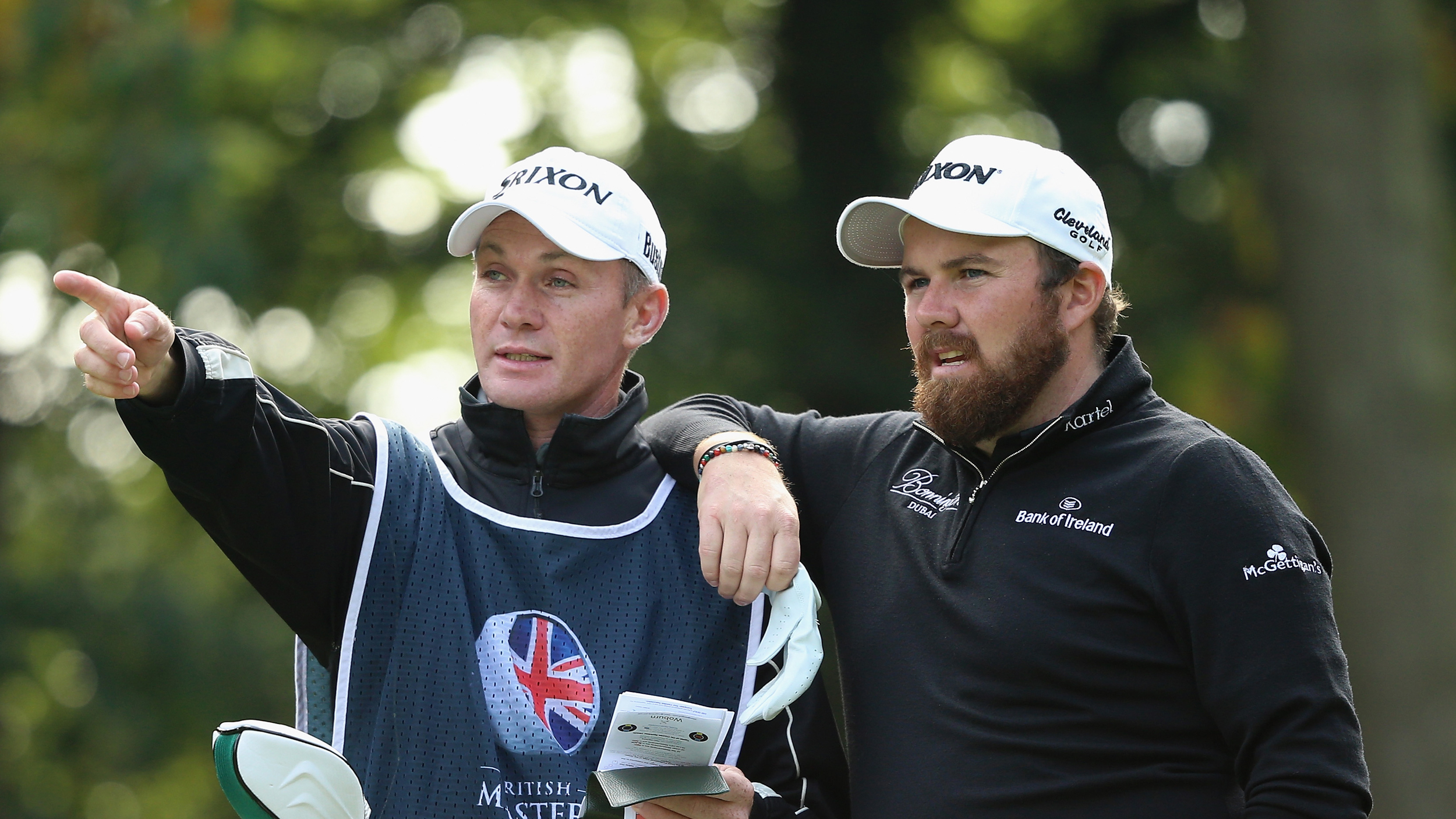 Dermot Byrne (left) and Shane Lowry discuss a shot during round four of the 2015 British Masters