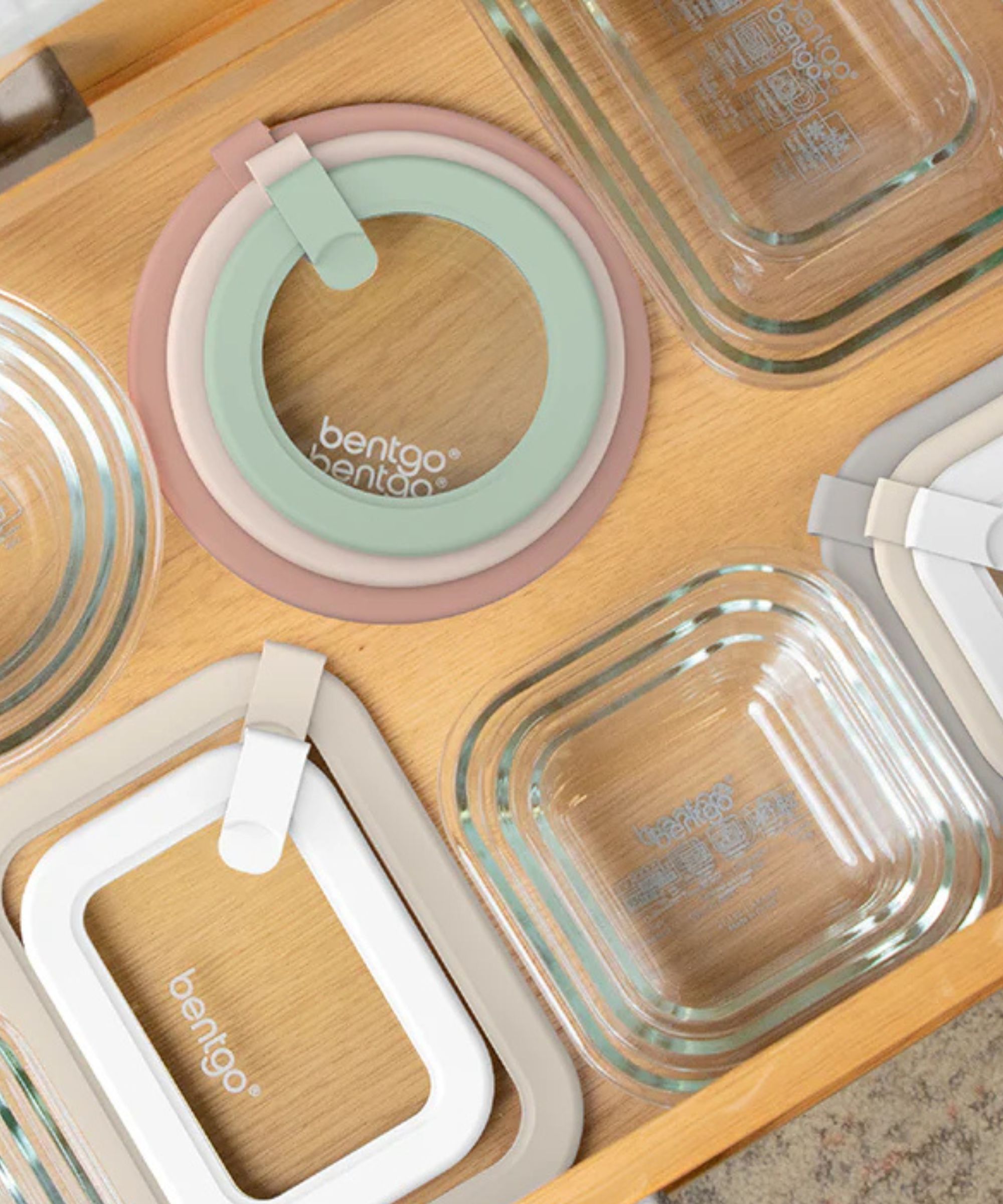 Glass food storage containers with matching lids.