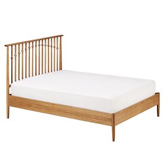 Conran Unsworth wooden bed frame with white fitted sheet