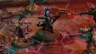 Models laid out on a board from Darktide: The Miniatures Game