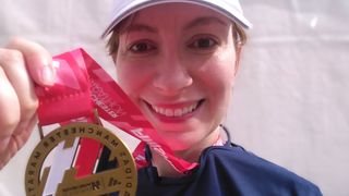 Cat Ellis with Manchester Marathon medal