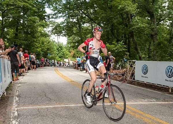 Tyler Wren (Jamis) loads up on ice after the hot climb up Paris Mountain.