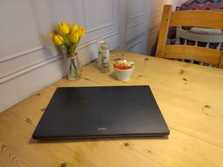 An Acer Aspire 7 sitting on a wooden desk