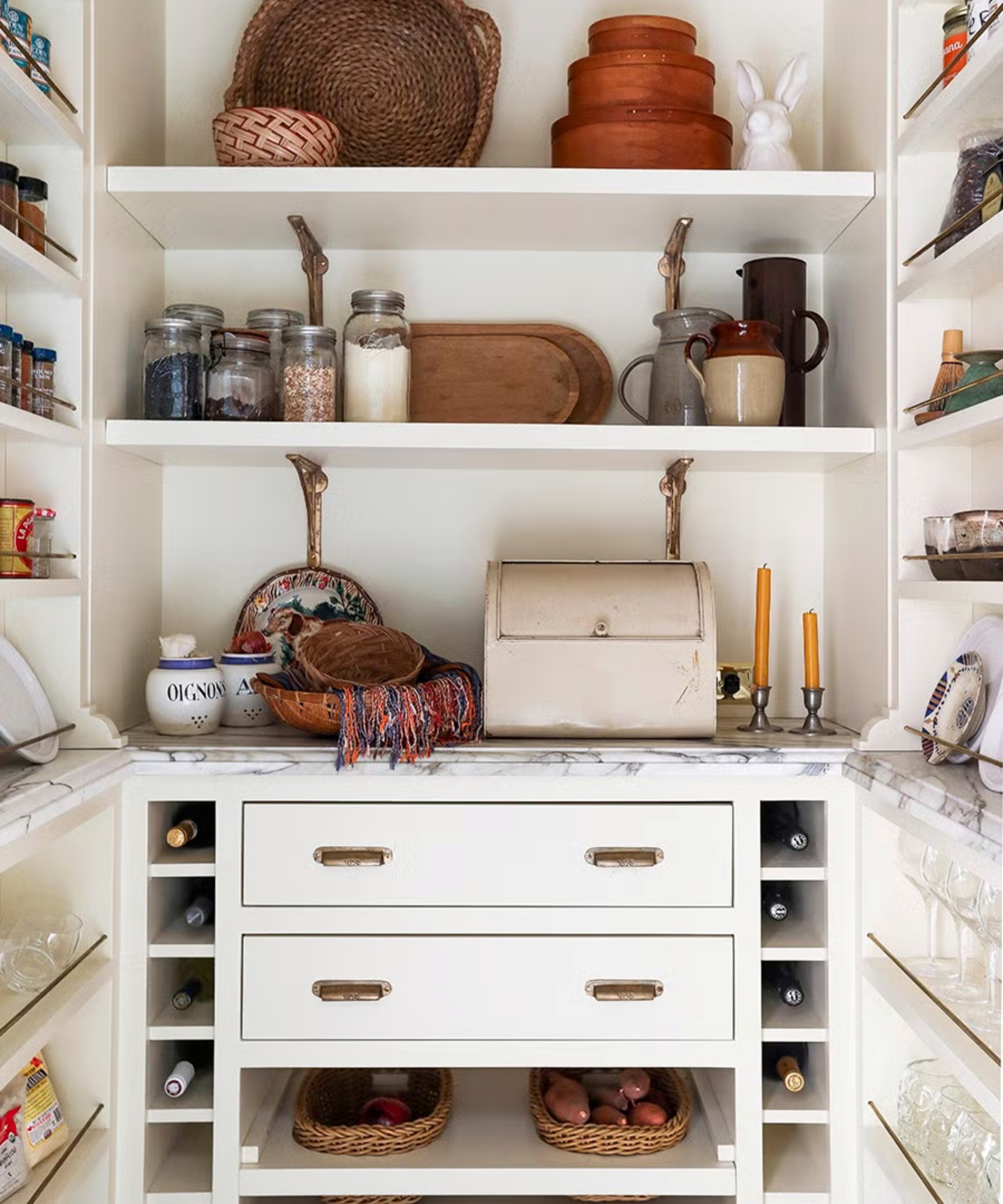 White rustic pantry with shelving, drawers and cubbies for wine storage