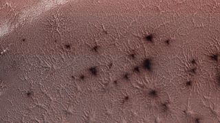 NASA's Mars Reconnaissance Orbiter captured this image of the "spiders" at Mars' south pole on May 13, 2018.