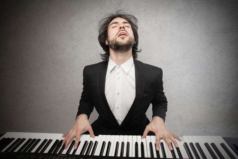 man in tuxedo playing piano