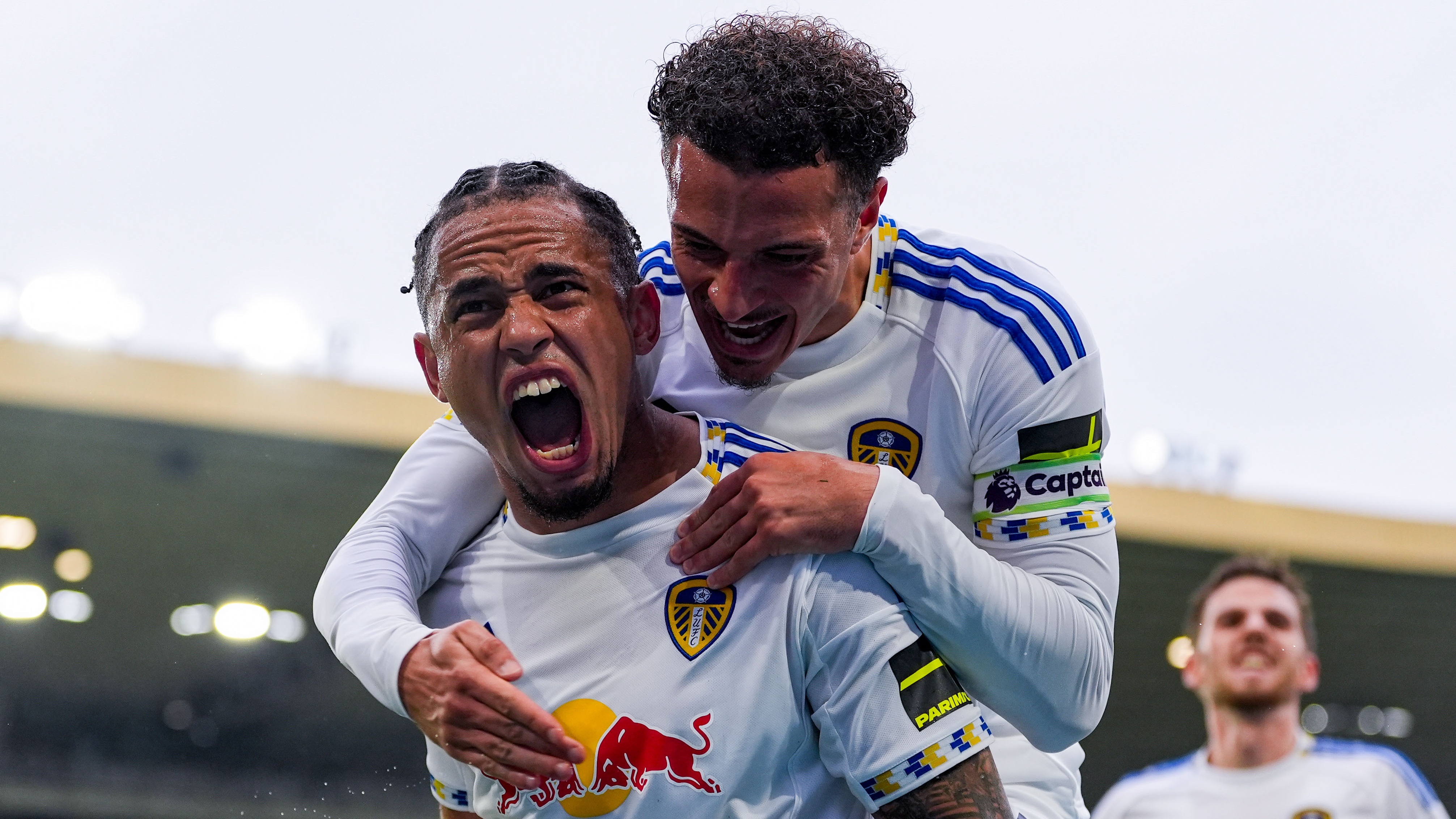 Noah Okafor of Leeds United celebrates scoring Leeds third goal with Ethan Ampadu of Leeds United during the Premier League match between Wolverhampton Wanderers and Leeds United at Molineux on September 20, 2025 in Wolverhampton, England.
