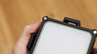 Zhiyun FIVERAY M20C LED panel magnetic attachments held in a hand