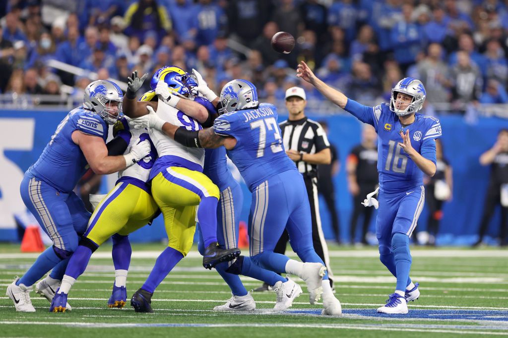  Jared Goff #16 of the Detroit Lions throws the ball during the first quarter against the Los Angeles Rams in the NFC Wild Card Playoffs at Ford Field on January 14, 2024 