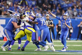  Jared Goff #16 of the Detroit Lions throws the ball during the first quarter against the Los Angeles Rams in the NFC Wild Card Playoffs at Ford Field on January 14, 2024 