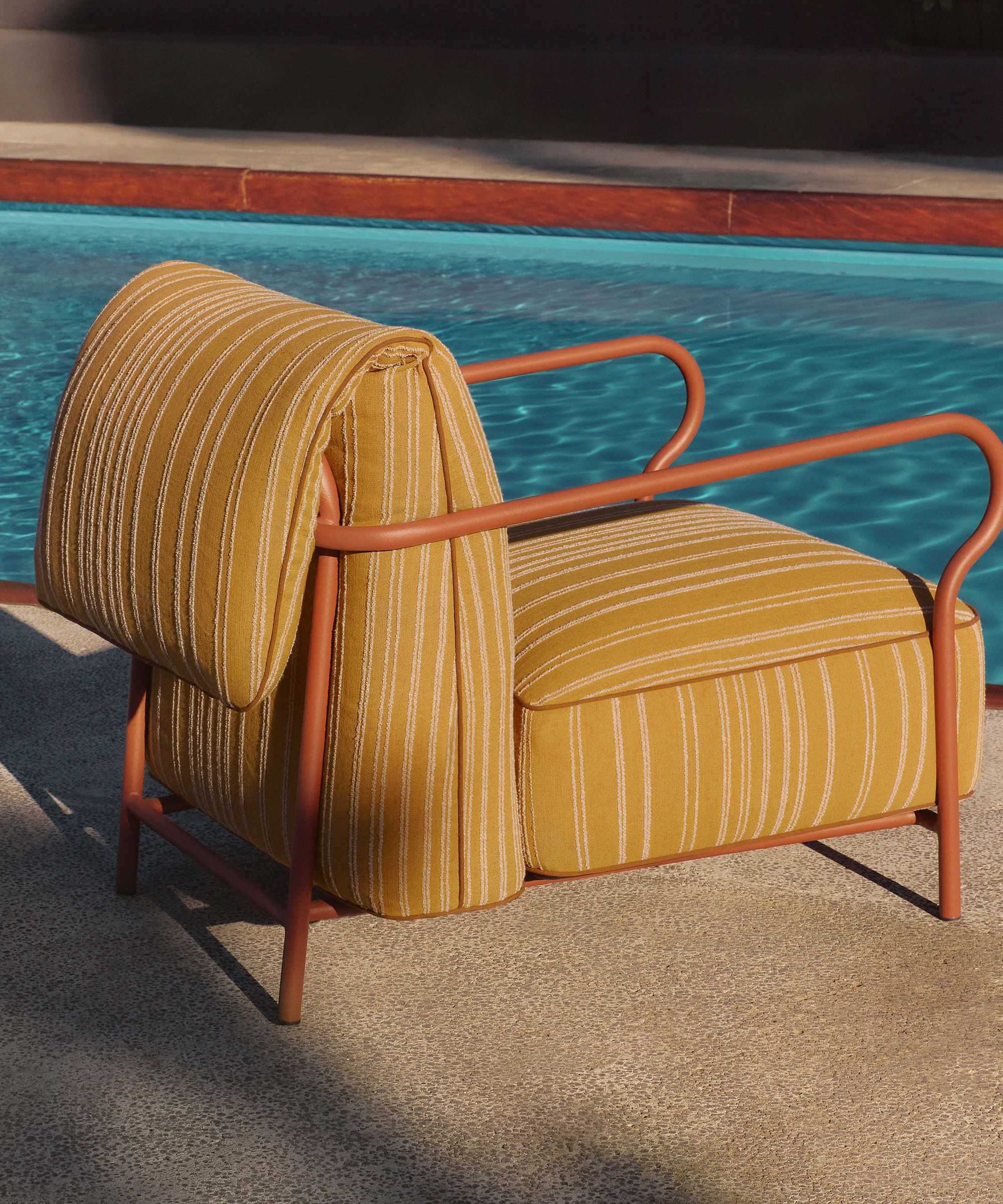 outdoor chair by a pool