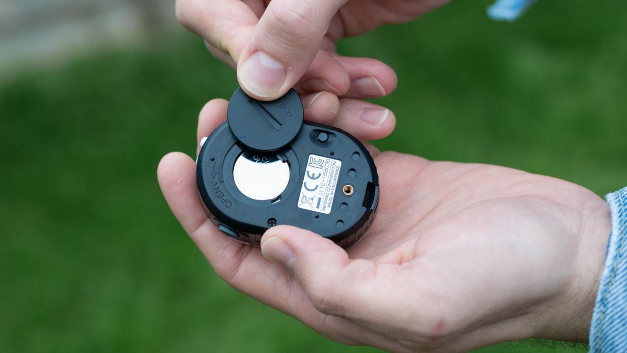 CR2032 battery being inserted into Sekonic Twinmate L-208