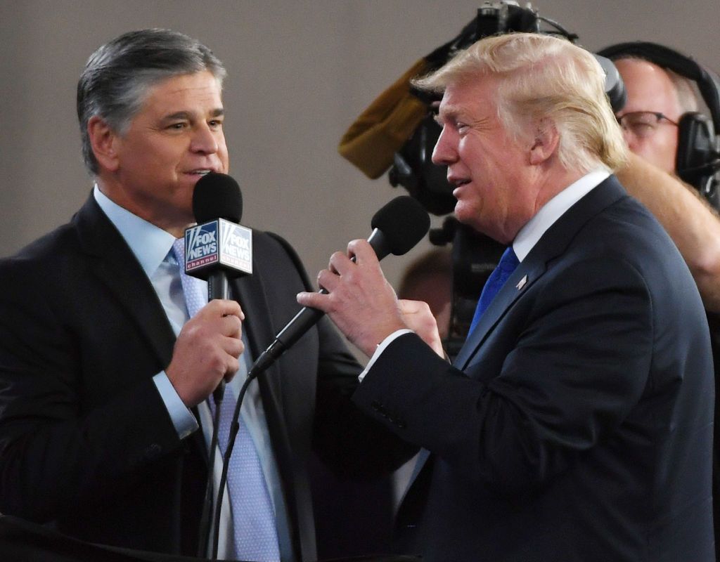 Fox News Channel and radio talk show host Sean Hannity (L) interviews U.S. President Donald Trump before a campaign rally at the Las Vegas Convention Center on September 20, 2018 in Las Vegas