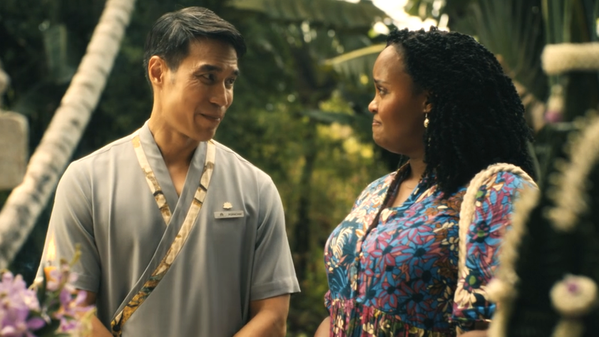 Dom Hetrakul and Natasha Rothwell smiling at each other outside in The White Lotus Season 3, episode 1