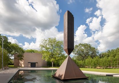 Monument in the gardens of a reopened chapel