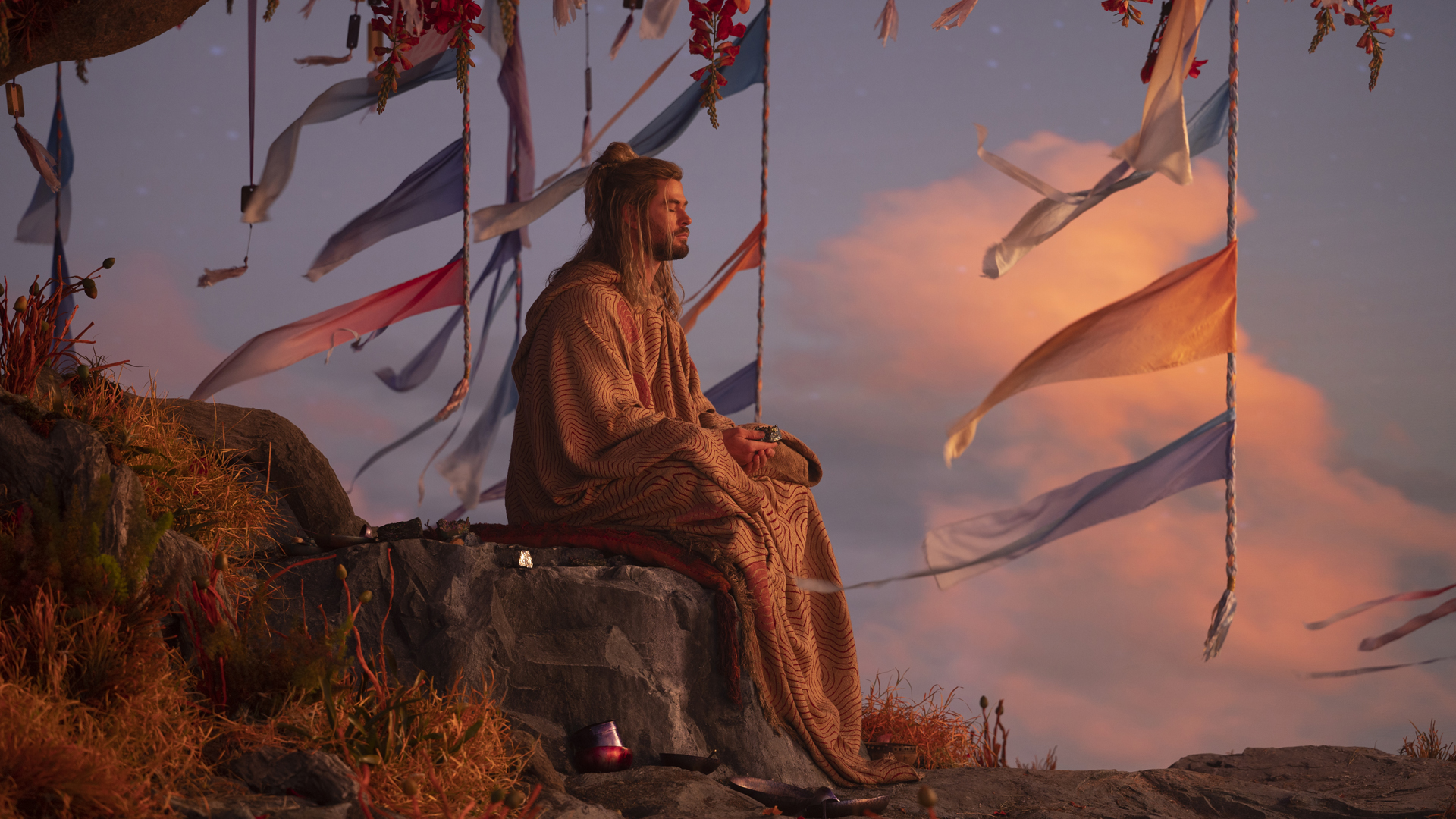 Thor meditates under a tree in Marvel Studios' Thor: Love and Thunder