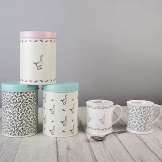 table with storage tins and mugs