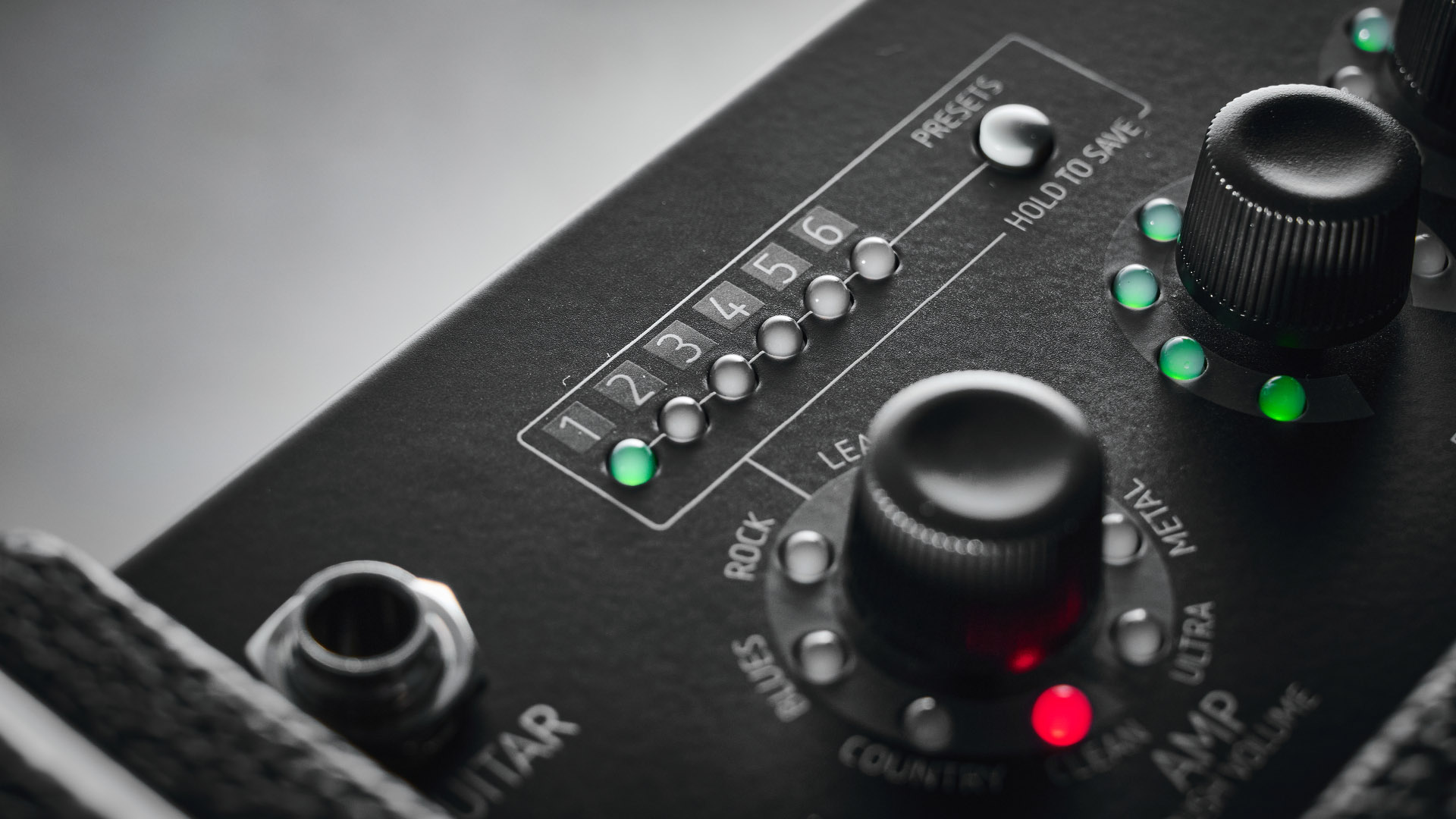 Harley Benton DNAFX AmP20: the compact 1/8&quot; modelling combo is finished in black and photographed in close-up and against a slate floor