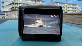 Pixel Fold propped up on table with live stream of White Marlin Open playing